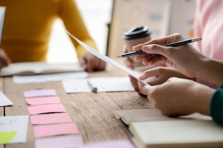 Two co-founders reviewing plans at a table
